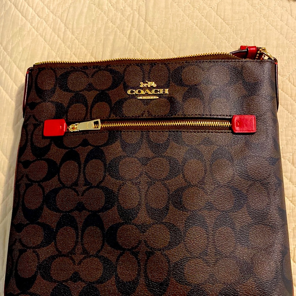 Large Coach crossbody brown with red strap